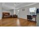 Spacious main bedroom featuring tray ceilings, hardwood floors, and natural light at 1387 Sw Haynes Meadow Trl, Grayson, GA 30017