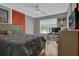 Cozy bedroom with wooden bed frame and large window at 1387 Sw Haynes Meadow Trl, Grayson, GA 30017
