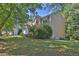 Lovely suburban home with a manicured lawn and mature trees at 1387 Sw Haynes Meadow Trl, Grayson, GA 30017