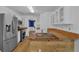 Eat in kitchen with stainless steel appliances and a breakfast bar with seating at 1387 Sw Haynes Meadow Trl, Grayson, GA 30017