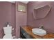 Charming powder room featuring a rustic vanity, vessel sink, and stylish decor at 1387 Sw Haynes Meadow Trl, Grayson, GA 30017