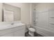 Bathroom featuring a combo tub shower, and a white vanity at 301 Sandy Oak Dr, Loganville, GA 30052