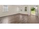Open-concept living area with hardwood flooring and ample natural light at 301 Sandy Oak Dr, Loganville, GA 30052