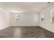 Bright living room featuring elegant trim and hardwood flooring at 301 Sandy Oak Dr, Loganville, GA 30052