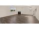 Bright living room with a fireplace, hard surface floors, and large windows that allow ample natural light at 301 Sandy Oak Dr, Loganville, GA 30052
