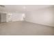 Spacious, carpeted living room with neutral tones and recessed lighting at 301 Sandy Oak Dr, Loganville, GA 30052