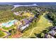 Aerial view of community featuring golf course, pool, lake and wooded areas, highlighting the beautiful surroundings at 424 Lake Point Trce, Canton, GA 30114