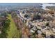 Aerial view of a neighborhood featuring a swimming pool and scenic landscape, close to a lake at 424 Lake Point Trce, Canton, GA 30114