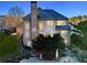 An exterior view of the home with a chimney, back yard, and partial view of the patio at 424 Lake Point Trce, Canton, GA 30114