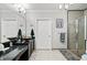 Well-lit bathroom with a granite countertop vanity, vessel sink, and walk-in shower at 424 Lake Point Trce, Canton, GA 30114