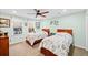 Inviting bedroom featuring two beds, neutral walls, a ceiling fan and a bright window at 424 Lake Point Trce, Canton, GA 30114