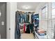 Bright walk-in closet with clothes rack and lots of natural light from a large window at 424 Lake Point Trce, Canton, GA 30114