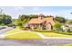 Exterior shot of the community clubhouse with a stone facade, large windows and well manicured landscape at 424 Lake Point Trce, Canton, GA 30114