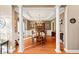 Traditional dining room with hardwood floors, wainscoting, tray ceiling, and elegant chandelier at 424 Lake Point Trce, Canton, GA 30114