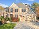 Charming two-story brick home with a manicured lawn and a two-car garage at 424 Lake Point Trce, Canton, GA 30114