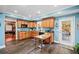 Cozy eat-in kitchen featuring wooden cabinets, dark laminate floors and a center island at 424 Lake Point Trce, Canton, GA 30114