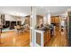 Spacious open floor plan with a dining area that leads to a modern kitchen with an island and bar stools at 424 Lake Point Trce, Canton, GA 30114