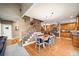 Open-concept living space with staircase, dining area, and kitchen at 424 Lake Point Trce, Canton, GA 30114