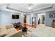 Comfortable main bedroom featuring a seating area, modern furniture and hardwood floors at 424 Lake Point Trce, Canton, GA 30114