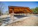 Open-air pavilion with a wooden roof and sturdy support beams, ideal for community events and gatherings at 424 Lake Point Trce, Canton, GA 30114