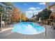 Beautiful in-ground pool surrounded by ample seating and lush landscaping at 424 Lake Point Trce, Canton, GA 30114