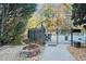 Community pool area with fire pit and surrounding gravel, offering a relaxing outdoor space at 424 Lake Point Trce, Canton, GA 30114