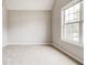 Bedroom with carpet, neutral paint, and a window at 7006 Mahonia Place, Stonecrest, GA 30038