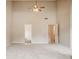 Large bedroom offers a ceiling fan and a neutral color palette at 7006 Mahonia Place, Stonecrest, GA 30038
