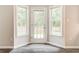 Bright breakfast nook with lots of windows and door to backyard at 7006 Mahonia Place, Stonecrest, GA 30038