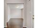 Hallway with dark hardwood floors leads to a bright, open room at 7006 Mahonia Place, Stonecrest, GA 30038
