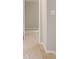 Hallway with carpeted floors and neutral paint at 7006 Mahonia Place, Stonecrest, GA 30038