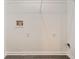 Empty laundry room with washer/dryer hookups and storage at 7006 Mahonia Place, Stonecrest, GA 30038