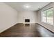 Inviting living room features a fireplace and stylish dark hardwood floors at 7006 Mahonia Place, Stonecrest, GA 30038
