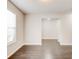 Living room with hardwood floors and a window for natural light at 7006 Mahonia Place, Stonecrest, GA 30038