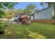 Expansive backyard featuring a wooden deck, lush lawn, and privacy fence, perfect for outdoor gatherings at 845 Oak Nw St, Atlanta, GA 30318