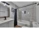 Bathroom features a tub with marble tile surround and modern fixtures at 845 Oak Nw St, Atlanta, GA 30318