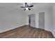 Bedroom featuring two doors, ceiling fan and laminate flooring at 845 Oak Nw St, Atlanta, GA 30318