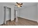 Spacious bedroom featuring laminate flooring, ceiling fan, closet space, and neutral walls at 845 Oak Nw St, Atlanta, GA 30318