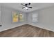 Bedroom view with window, ceiling fan and laminate flooring at 845 Oak Nw St, Atlanta, GA 30318