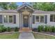 Front exterior featuring a cozy front porch, nice landscaping and great curb appeal at 845 Oak Nw St, Atlanta, GA 30318
