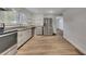 Well-lit kitchen showcasing stainless steel appliances, granite countertops, and wood floors at 845 Oak Nw St, Atlanta, GA 30318