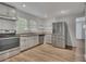 Well-lit kitchen with stainless steel appliances and granite countertops at 845 Oak Nw St, Atlanta, GA 30318