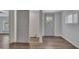 Spacious room with gray door, window, and hardwood floors at 845 Oak Nw St, Atlanta, GA 30318