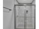 Modern bathroom shower with glass door and marble tile surround at 845 Oak Nw St, Atlanta, GA 30318