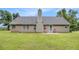 Back exterior featuring a well manicured lawn and cozy patio set at 169 Winding Valley Dr, Rockmart, GA 30153