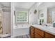 Bathroom featuring shower over tub, neutral paint, hardwood floors and updated fixtures at 169 Winding Valley Dr, Rockmart, GA 30153