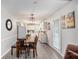 Dining area with table and chairs that transitions into the kitchen area, perfect for Gathering meals at 169 Winding Valley Dr, Rockmart, GA 30153