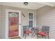Inviting front porch featuring seating and decorative details, enhancing the home's curb appeal at 169 Winding Valley Dr, Rockmart, GA 30153