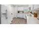 Bright kitchen with stainless appliances, white cabinetry, backsplash and hardwood flooring at 169 Winding Valley Dr, Rockmart, GA 30153