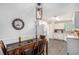 Bright kitchen with stainless appliances, white cabinetry, adjacent dining area and hardwood flooring at 169 Winding Valley Dr, Rockmart, GA 30153